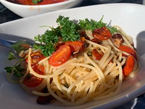 Spaghetti Puttanesca comes in olive oil, capers, roasted tomato, olives. It was delicious. at Loveria Caffè in Colleyville