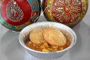 Kachori with aloo subzi (A famous Indian street food - moderately spiced lentils stuffed inside a flaky savoury pastry, served with traditional potato curry) at The Food Quotient in Brampton