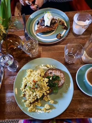 Vegetarian savoury French toast with mushrooms (back) and vegan tofu scramble (front) at Another Heart To Feed in Manchester