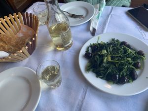 Greens with olives and white wine at To Kati Allo in Athens