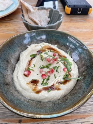 Hummus with pomegranate and bread   at Donna Vegana in Mallorca