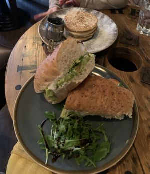 Avocado salad baguette & pancakes with a pot of maple syrup  at No. 18 Coffee House in Tamworth