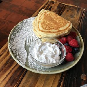 Pancakes (not advertised as vegan but adapted) with berries and vegan cream at No. 18 Coffee House in Tamworth