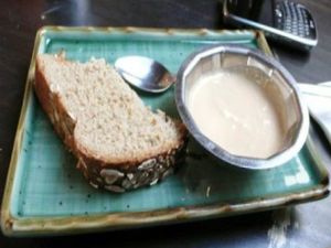 Temple green salad comes with bread and tahini sauce for dipping. at The Green Temple in Redondo Beach