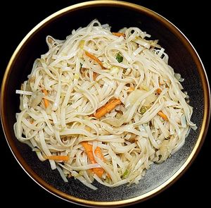 Robust, thick rice noodles combined with crunchy vegetables and a rich, flavorful sauce for a heartier, satisfying taste experience. at Noodle House in Istanbul