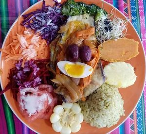 Breaded eggplant with a vinegar souce accompained with peruvian corn, sweet potatoes, brown rice with herbs, and rainbow salad.
Escabeche de Berengena at El Puerto de la Salud in Lima