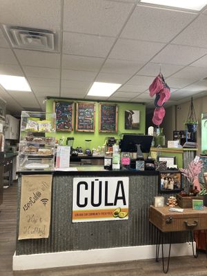 The counter with baked goods and a specials list at Cula Cafe in Clare