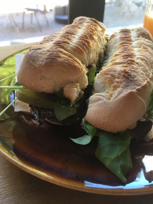 Vegan sandwich with mushrooms, arugula, pickles at La Finca in Mallorca