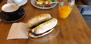 Vegan sandwich with beet root and mushrooms and local bread. Fresh orange juice. Cafe was too good to wait.😄Very tasty! at La Finca in Mallorca