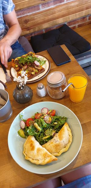 Front: vegan crispy empanadas with salad. Behind: roasted bread with sweet potatoe. Delicious! at La Finca in Mallorca