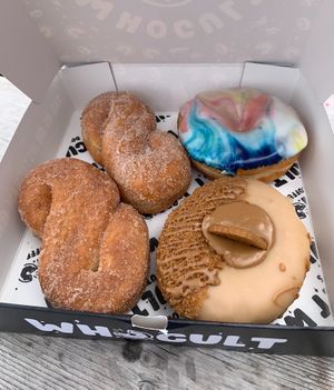 cinnamon twist, cosmic glaze and biscoff donuts (all vegan🌱)  at WHO CULT in Bridgend