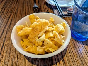 Fried wonton strips which were provided complimentary due to a very long wait for our food. 22 June 2025. at Mudbar in Launceston