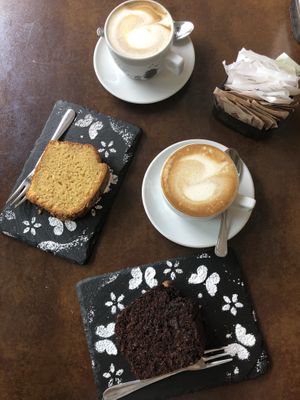 Soy cappuccino and soy vanilla cappuccino. Orange and almond cake. Chocolate and nut cake. at Senso Unico in Olbia