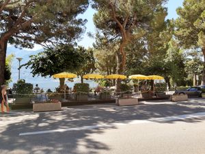 Seating across the road at the lake at Sensi in Muralto