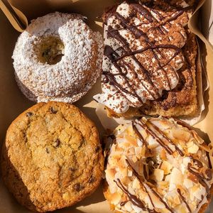 Frosted Blueberry donut, Tiramisu, chocolate chip cookies, Samoa donut at Erin McKenna's Bakery in Santa Monica