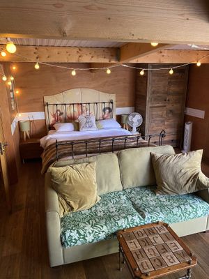 Bed in the main room (The cabin)  at The Base Vegan Retreat & Small Animal Sanctuary in Bristol
