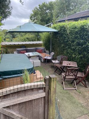 Seating area in the garden ( hot tub can be hired for extra)  at The Base Vegan Retreat & Small Animal Sanctuary in Bristol