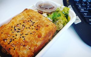Takeaway sausage roll with salad at Home Vegan Bar in Docklands