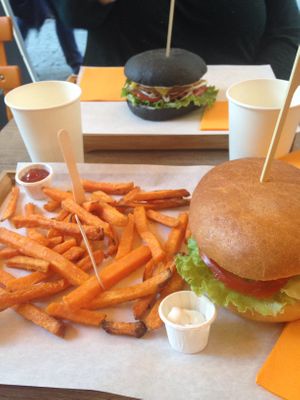 Seitan Burger on top, chickpea one on the bottom. Served with sweet potato fries. at Gourmet Burger in Paris