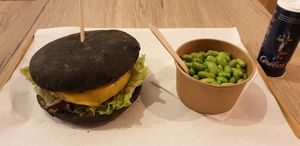 Burger with charcoal bun + edamame beans at Gourmet Burger in Paris