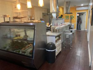 Kitchen area with sitting area, bathroom to the right at the back (clean and well put) at NewLife Natural Vegetation Cell Food in Nassau