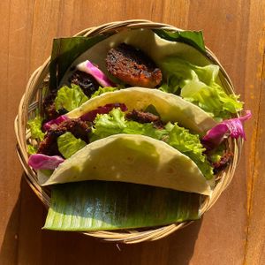 Soft tacos filled with salad, our signature grilled chicken, and homemade vinaigrette dressing at Go Vegan Bali in Tibubeneng