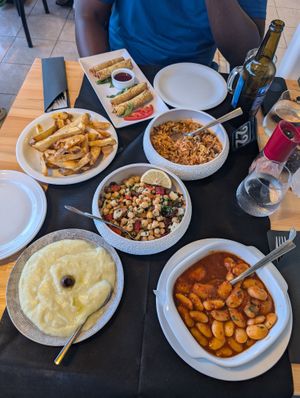 Chips, chickpea salad, giant beans in red sauce, mashed potato dip  at da Veronica in Kefalonia