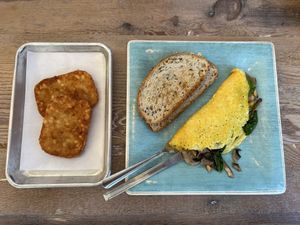 Veggie Lovers Omelette with a side of hash browns  at Turf Surf & Earth in Somerville