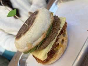 Breakfast Sandwich on an English muffin with added hash brown and avocado   at Turf Surf & Earth in Somerville