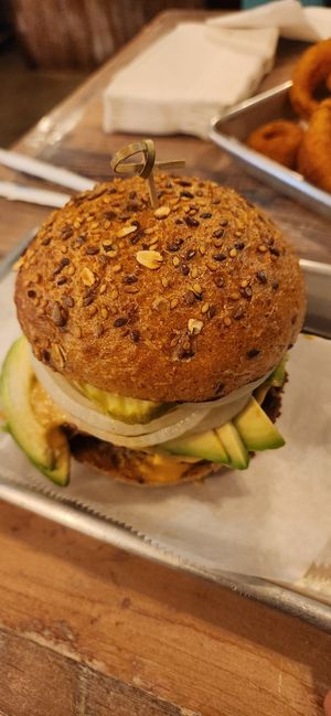Lentil and Mushroom Double Burgee with Whole Wheat Bun, Cashew Cheese, Onions, Pickels and Avocado at Turf Surf & Earth in Somerville