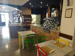 Inside tables with view in kitchen and counter at Un Gelsomino in Salerno