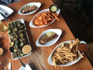 Brussel Sprouts, Sweet Potatoes and Regular French Fries, Beyond Sausage! All Vegan, All Delicious. Ask for items to be vegan some modification needed on Brussel Sprouts!  at Bavarian Bar & Bistro in Leavenworth