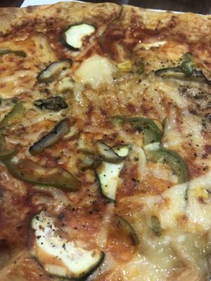 vegan pizza slice at Holyfood Delight in Ljubljana