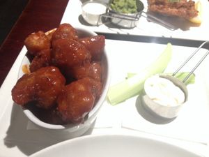 Cauliflower bites. Not bad, but too much spicy sauce overpowers the flavour & texture. at Abbey Tavern in Howth