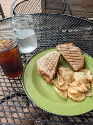 Vegan walnut burger, chips, and an iced coffee. at Brewed Awakenings in Appleton