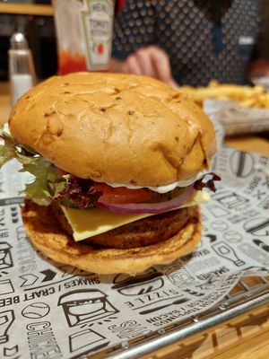 Spicy jalapeño burger and french fries at the back at Smashburger in Brighton