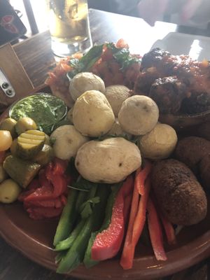 Vegan plater, vegetable balls in tomato sauce, Mushroom croquet, Canarian Potatoes, Olives and vegetables with a green mojito sauce and bread.
Really tasty  at Bar La Galeria in Lanzarote