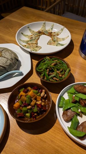 Kung pao, vegan pork n pepper, sausage and string pea, rice in leaf and crepe style savoury bread at A Lotus on the Water 清水荷花 - 文殊坊店 in Chengdu