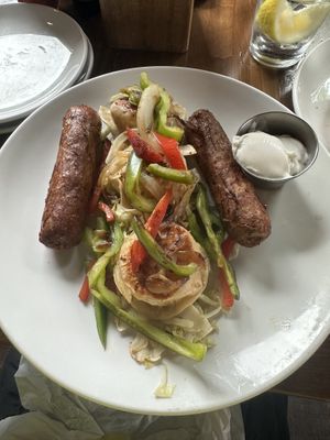 Kielbasa and pierogi on a bed of sweet sauerkraut, with sour cream    at Rowley Inn in Cleveland