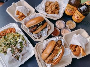 BBQ pulled pork, fried chicken, adobo wings and grandeur salad  at Grandeur in Oakland