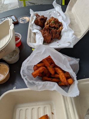 Sweet potato fries and cauliflower wings (Sriracha aioli and ranch, both vegan, on the left at Grandeur in Oakland