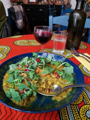 Indian Curry with lentils, sweet potatoes, rice etc. and a glass of wine 🤗😍 at Monkey Mood in Bordeaux
