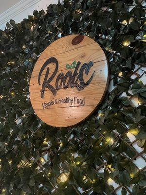 The logo  at Roots Veggie & Healthy Food in Barranquilla