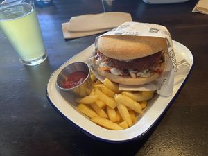 Cauliflower burger - only thing here I haven’t liked. Give me a gluten bun!   at Moon Under Water in Christchurch