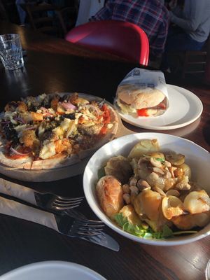 Burger, pizza, and potatoes at Moon Under Water in Christchurch