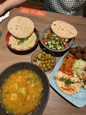 Babaganoush + Arabic Salad + Couscous Soup + Olives + Falafel Plate  at Hummus Bar - Wesselényi in Budapest