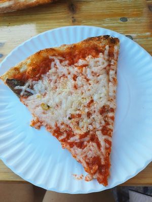 A slice of vegan pizza with Daiya cheese. at Umberto's in Sayville