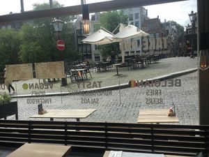 Outside sitting area on a bridge at Ellis Gourmet Burger in Amsterdam