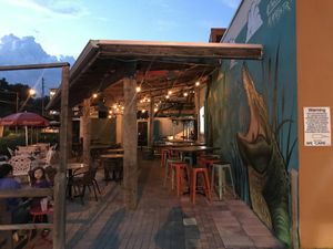 Cool outdoor seating area with big screen and lots of seating!  at Tamiami Tap in Sarasota