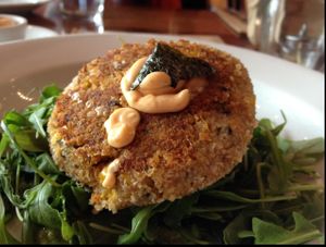 Sea Cake topped with a spicy aioli sauce at Real Food Daily in Santa Monica